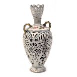 A late 19thC Rudolstadt porcelain twin handled vase, of baluster form, with reticulated decoration,