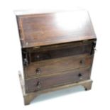 A late Victorian mahogany apprentice bureau, with satin wood cross banding, the fall flap opening to