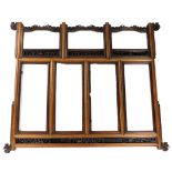 A decorative Chinese hardwood frame screen, with seven glazed panels arranged in two rows, the upper