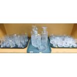 A quantity of cut glass and glassware, including three decanters, large jug, whisky glasses, etc. (