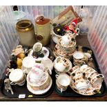 An assortment of ceramic items, including foot warmers, some small animal items and part tea service