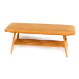 An Ercol light elm coffee table, the rectangular top with a rounded edge, above a slatted under tier