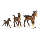 Three Beswick pottery horses, the largest 15cm high.