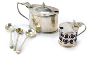 Two silver mustard pots, comprising an oval shape mustard with blue glass liner, George V, and a sma
