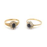 Two 9ct gold dress rings, each formed as a cluster with central sapphire surrounded by imitation dia