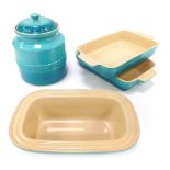 A group of Le Creuset blue dinnerwares, comprising two ovenware dishes, a casserole dish and a stor