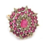 A 9ct gold cluster ring, the circular cluster set with halos of CZ and rubies, size P½, 4.9g all in.
