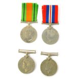 Four WWII medals, comprising three 1939-45 War medals and a Defence medal, two with ribbons.