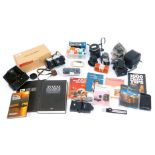 A group of cameras and related equipment, to include a Zenit-B camera, in case, a Prinzflex 28mm len