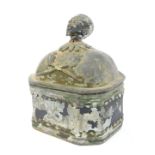 A 19thC lead tobacco jar, the lid cast with a male head above crossed clay pipes, some paint remaini