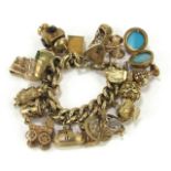 A 9ct gold curb link charm bracelet, with heart shaped padlock and safety chain as fitted, with nine