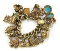 A 9ct gold curb link charm bracelet, with heart shaped padlock and safety chain as fitted, with nine