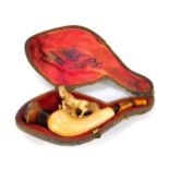 A Meerschaum pipe, with an amber cheroot and carved horse decoration, in fitted case. (AF)