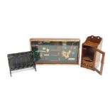 A group of smoking related items, to include a display case containing various reproduction pipes, 5