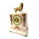 A late 19thC alabaster and ormolu mantel clock, the top with a roaring lion, with a circular cream n