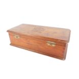 A 20thC oak cigar box stamped La Corona 100 Cabinet Miniature, the hinged lid enclosing a vacant int