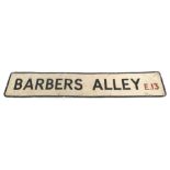 A 20thC street sign for Barbers Alley E13, 23cm x 123cm.