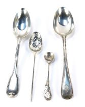 An Edward VII silver tablespoon, the handle with raised bead decoration, monogrammed, London 1904, a