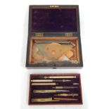 A late 19thC drawing instrument cased set, the top layer with multiple tools and a fitted and lined