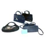 Four Radley leather handbags, comprising a black top handled bag with strap, dark blue top handled b