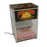 A mid century Gold Medal Products Company electric popcorn machine, 58cm high, 39cm wide, 32cm deep.