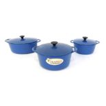 Three Cousance by Le Creuset blue cast iron casserole pots, 24cm diameter, 19.5cm diameter and an ov