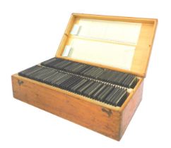 A pine case containing various slides, to include a Bach organ, Kremser Monument, various music room