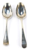 A Queen Anne silver serving spoon, initial engraved, London 1751, together with a George II silver s
