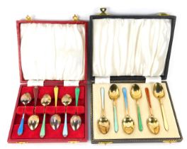 A set of six Elizabeth II silver and enamel teaspoons, cased Birmingham 1958, and a set of six silve