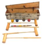 A croquet set, with mallets, balls and hoops, in a pine box, marked to the front The Roehampton Ayre