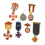 A group of Red Cross enamelled medals, named to M Turner 4482, Hilda Wollen 6851, HM Simmons 25718 a