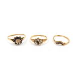 Three 9ct gold dress rings, each stone set, one wishbone with sapphires, another floral cluster with