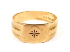 A 9ct gold signet ring, with rectangular panel, set with tiny diamond, with etched shoulders, size S