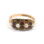 A 9ct gold dress ring, set as a panel with six rubies and four cultured pearls, with a fluted and ha