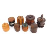 A group of early 20thC wooden tobacco jars, to include a turned rosewood example, 21cm high, an oak