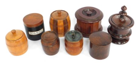 A group of early 20thC wooden tobacco jars, to include a turned rosewood example, 21cm high, an oak