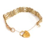 A 9ct gold gate bracelet, of four bar design, with safety chain and heart shaped padlock, 18cm long,