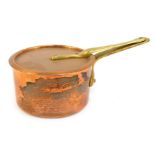 A Divertimenti of London copper saucepan and lid, with brass handle, 17cm diameter.