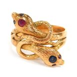 A 9ct gold serpent dress ring, set with rubies and sapphires, with cross over twist design, size S½,