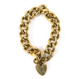 A 9ct gold heavy curb link bracelet, with heart shaped padlock clasp, safety chain as fitted, marked