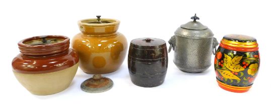 A group of tobacco jars, to include a hammered pewter example with lion mask handles, 20cm high, a s