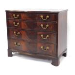 A George III figured mahogany serpentine fronted chest, of four drawers with triple veneer fronts an