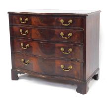 A George III figured mahogany serpentine fronted chest, of four drawers with triple veneer fronts an