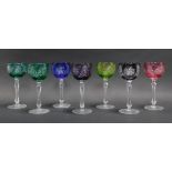 Seven Bohemian coloured hock glasses, each 20cm high.