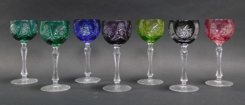 Seven Bohemian coloured hock glasses, each 20cm high.