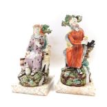 Two early 19thC Pearlware Biblical related figures, modelled as Elijah and the Raven, and The Widow,