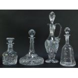 A group of decanters, to include ship's decanter, 30cm high, claret jug and stopper, 46cm high, etc.