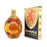 A bottle of Dimple Scotch Whisky, boxed.