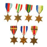 Seven WWII medals, comprising the Atlantic Star, the Pacific Star, the 1939-45 Star, the France and