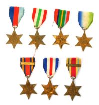 Seven WWII medals, comprising the Atlantic Star, the Pacific Star, the 1939-45 Star, the France and